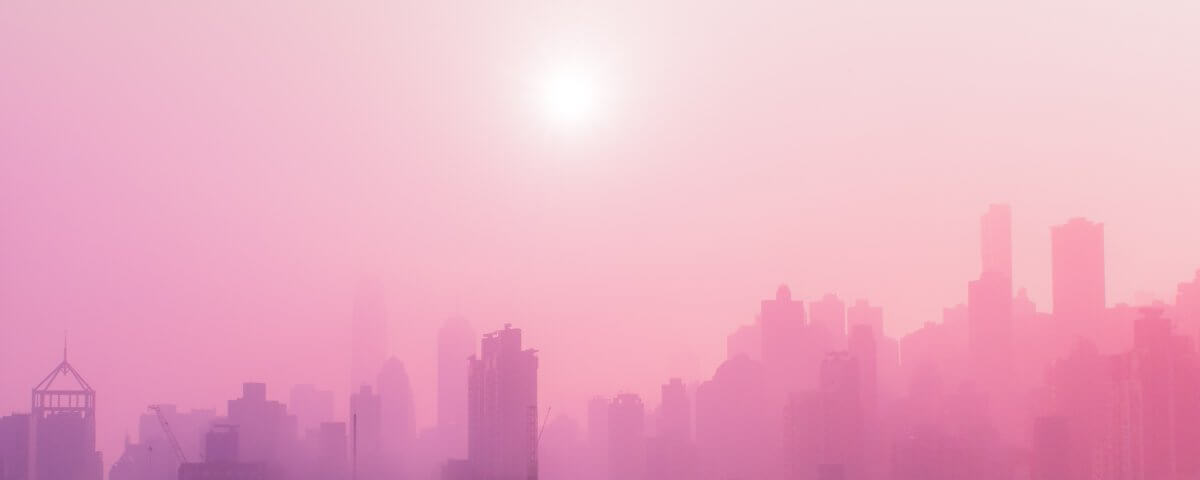 A hazy pink cityscape.