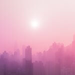 A hazy pink cityscape.